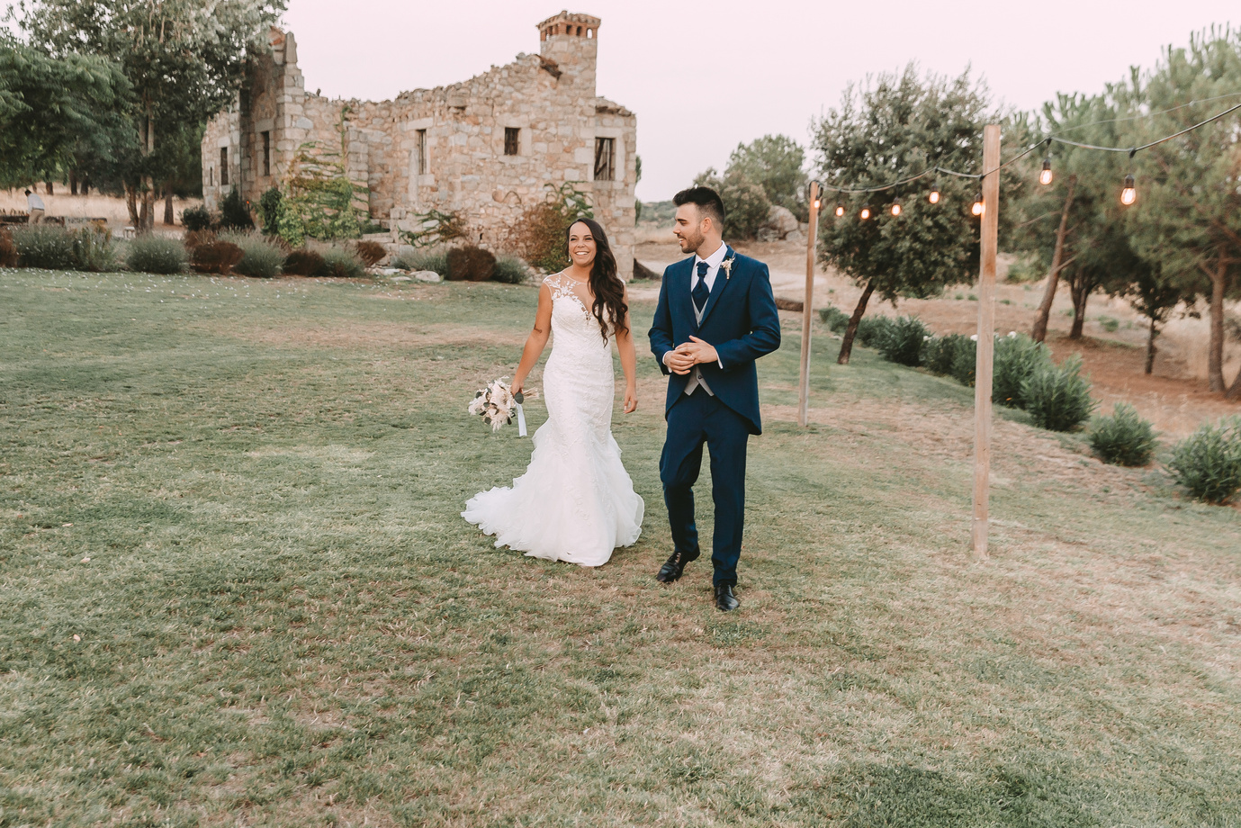 Newlywed Couple Posing Outdoors